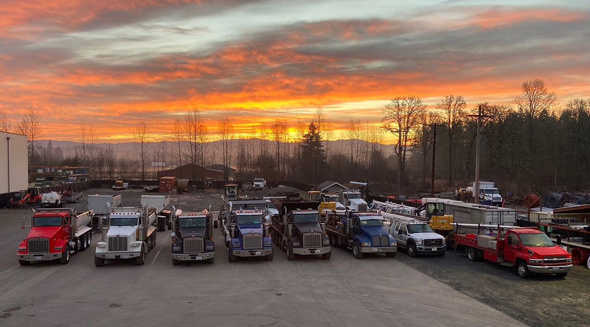 Tapani Excavation work trucks at sunset